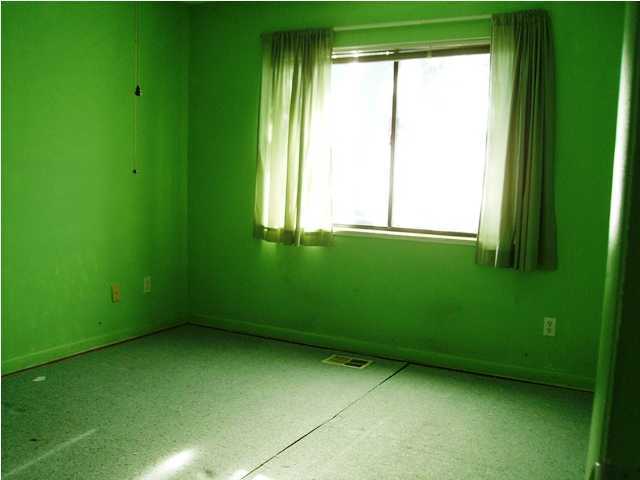 144 My Way, Unit B Santa Rosa Beach, FL 32459 - Photo 22 of 26 a view of an empty room with a window and a small yard