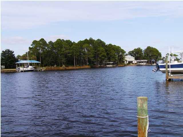 144 My Way, Unit B Santa Rosa Beach, FL 32459 - Photo 4 of 26 a view of a lake with houses