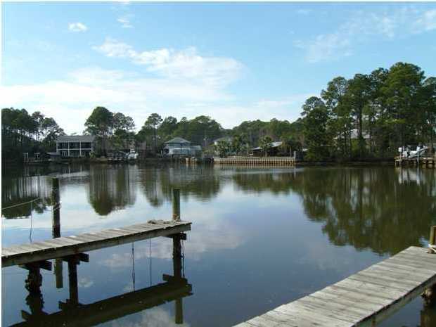 144 My Way, Unit B Santa Rosa Beach, FL 32459 - Photo 5 of 26 a view of a lake with a outdoor space