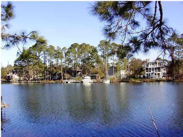 144 My Way, Unit B Santa Rosa Beach, FL 32459 - Photo 9 of 26 a view of a lake with houses