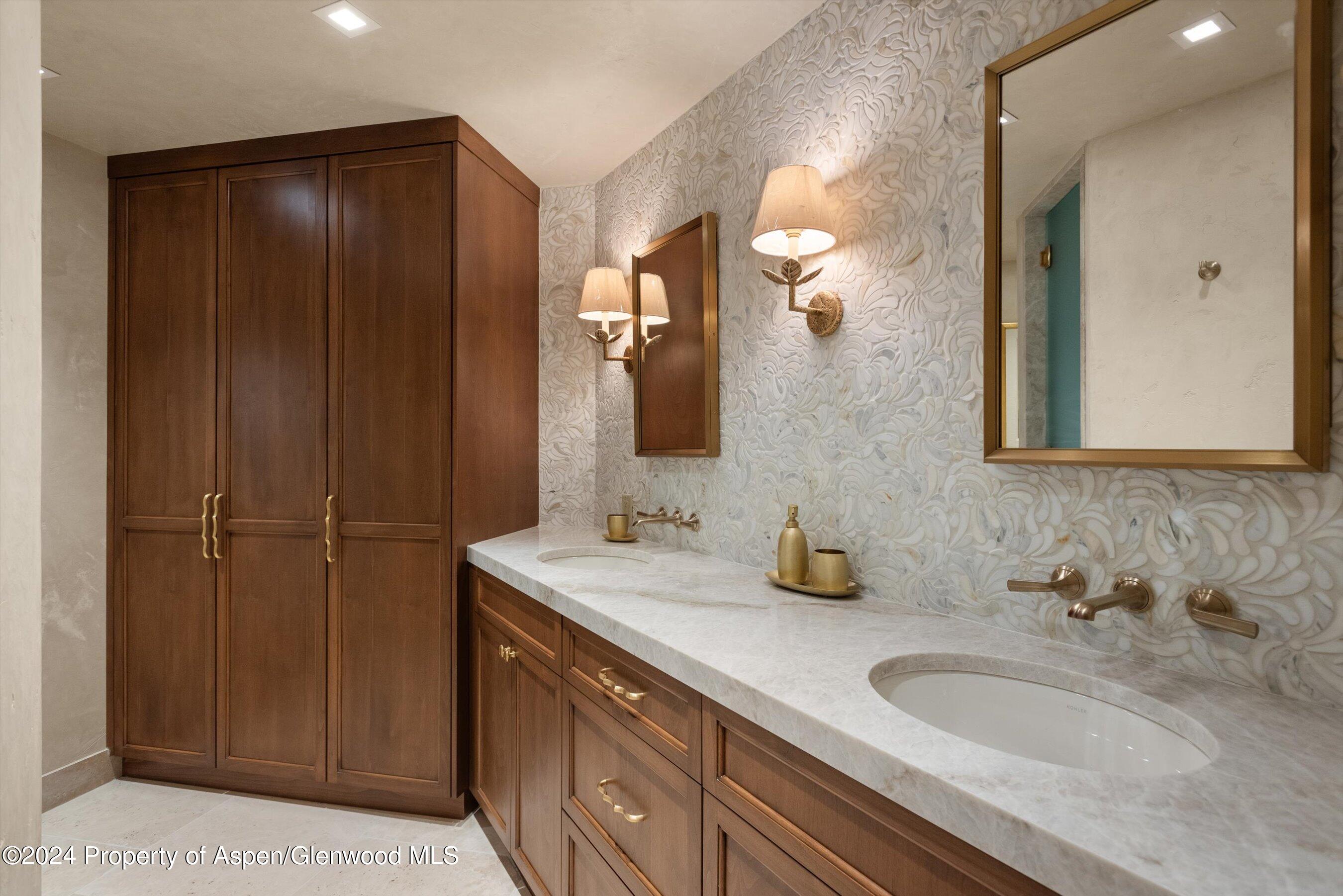 1439 Crystal Lake Road Aspen, CO 81611 - Photo 11 of 34 a bathroom with a double vanity sink and a mirror
