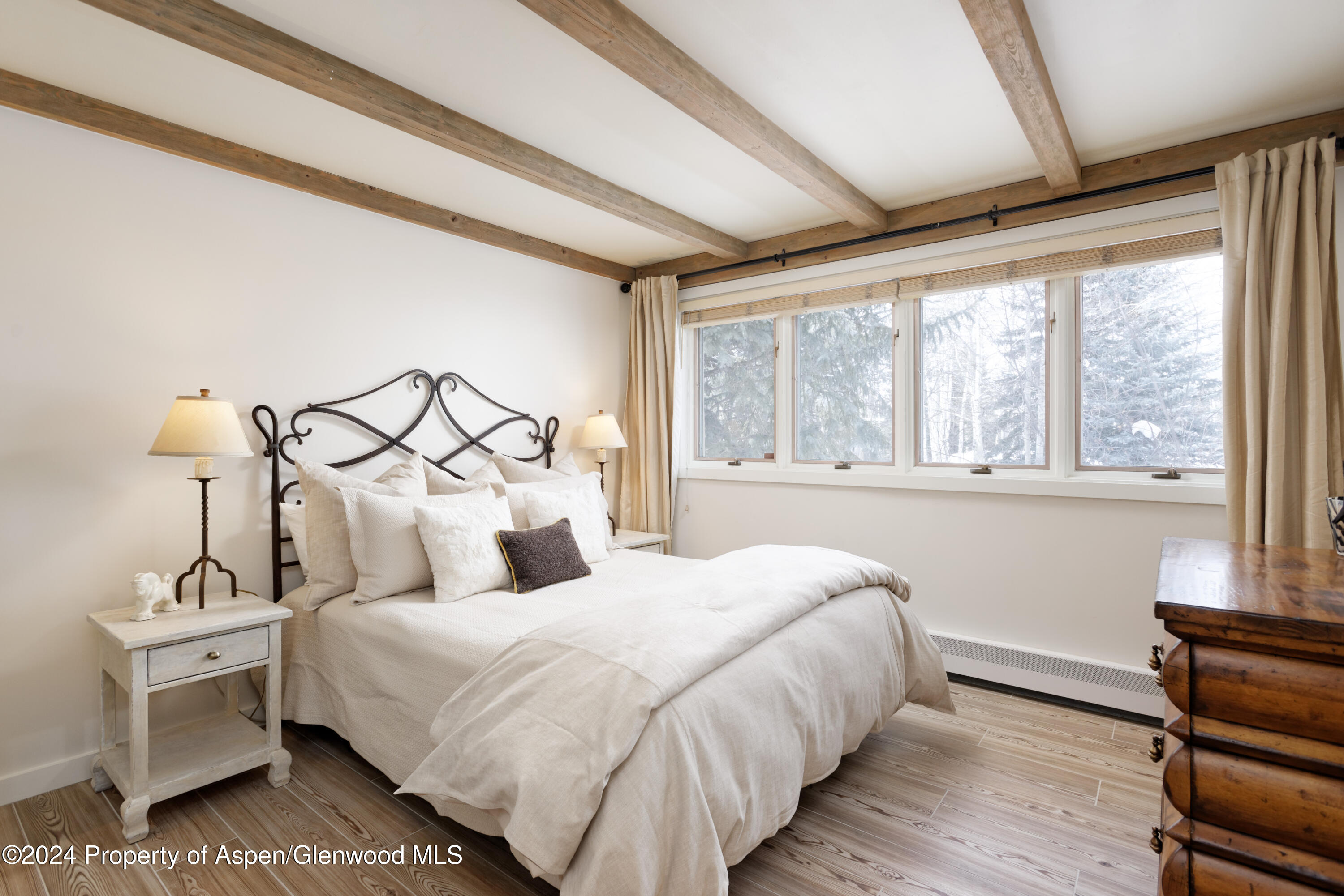 1439 Crystal Lake Road Aspen, CO 81611 - Photo 17 of 34 a bedroom with a bed and a window