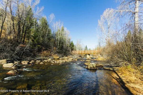 a bedroom with a bed and a fireplace