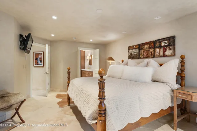 a view of a patio with couches table and chairs with wooden floor