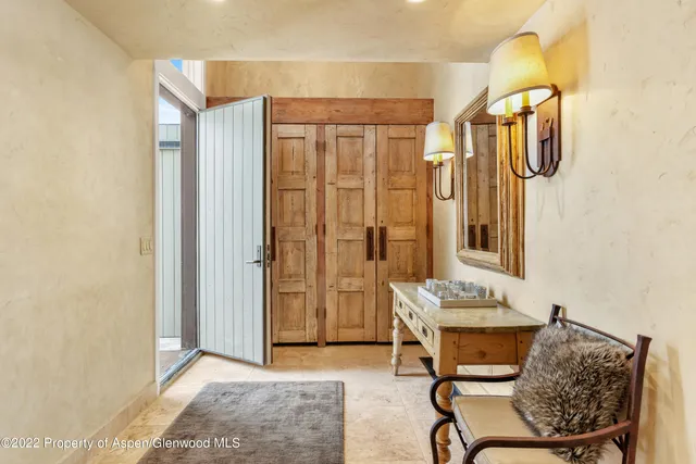 a dining room with furniture and bathroom view