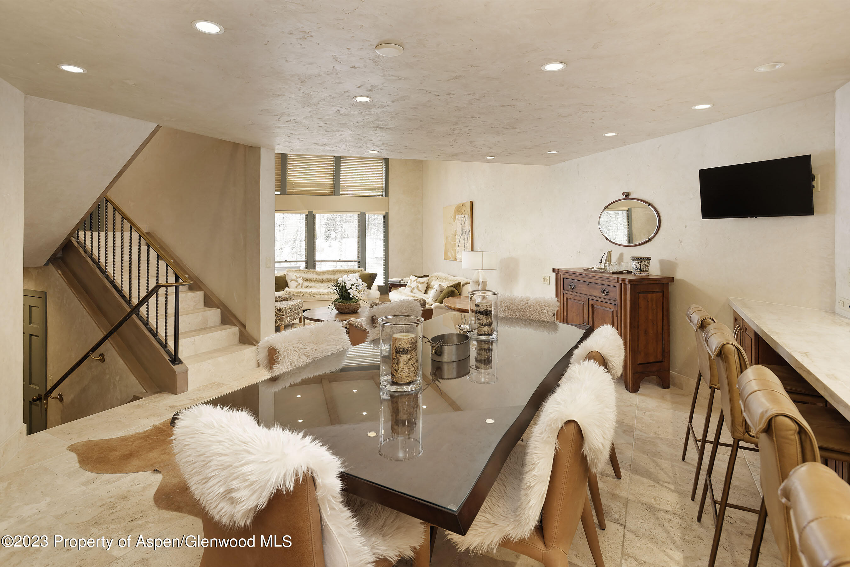 1439 Crystal Lake Road Aspen, CO 81611 - Photo 6 of 34 a living room with furniture and a flat screen tv