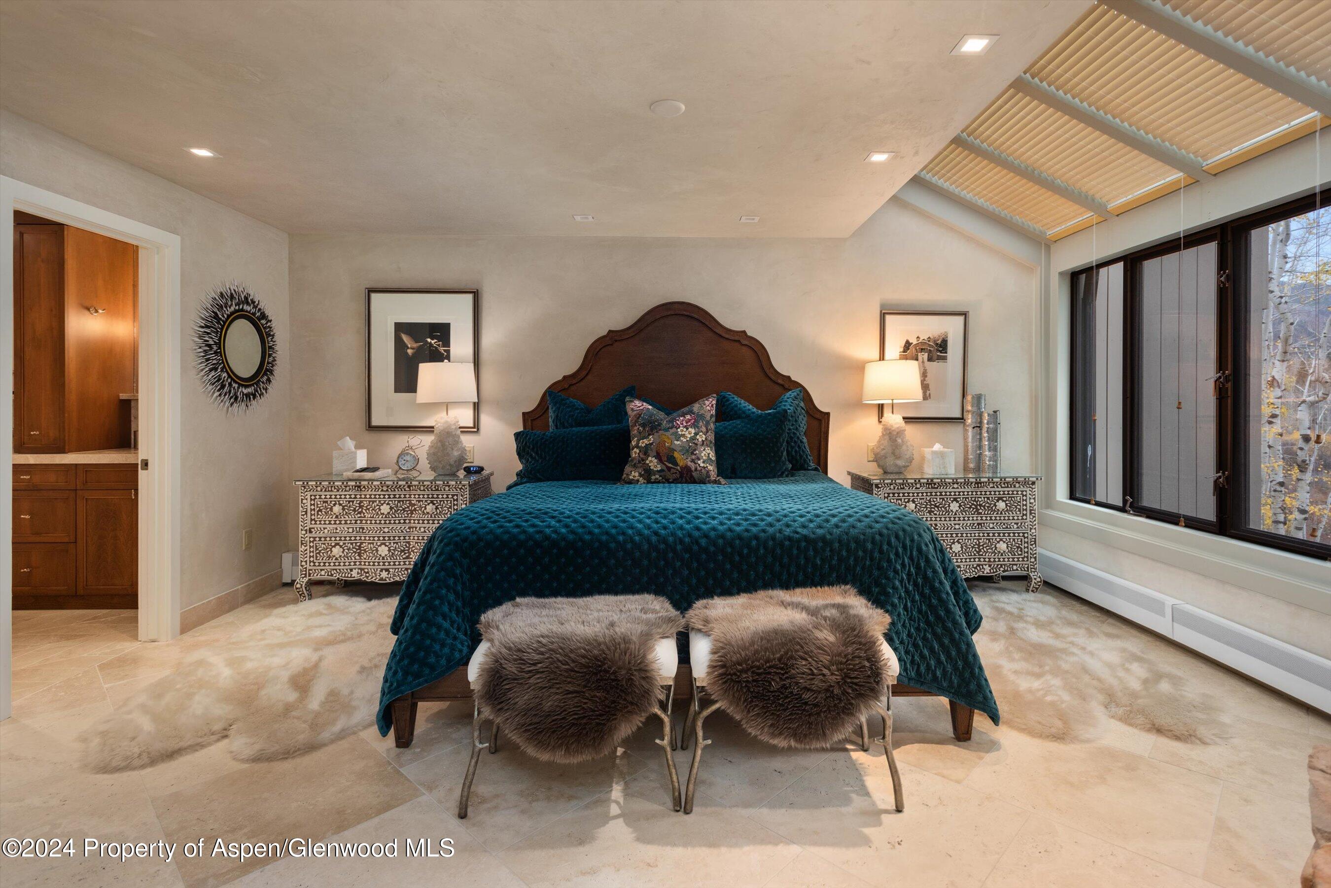 1439 Crystal Lake Road Aspen, CO 81611 - Photo 9 of 34 a bedroom with a bed and window