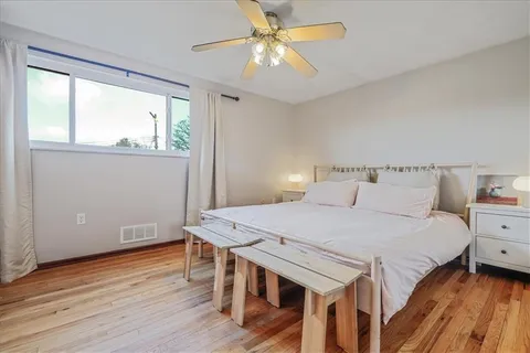 a bedroom with a bed and a table
