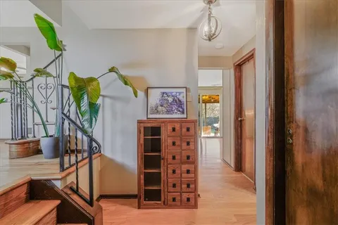 a view of a hallway with windows