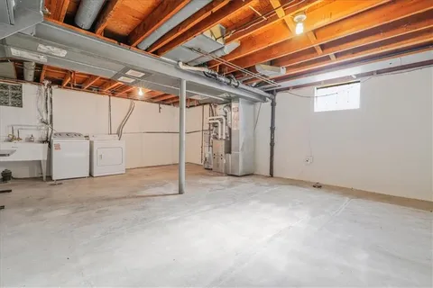 an aerial view of a house with garden space and street view