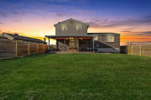 an aerial view of a house with a garden