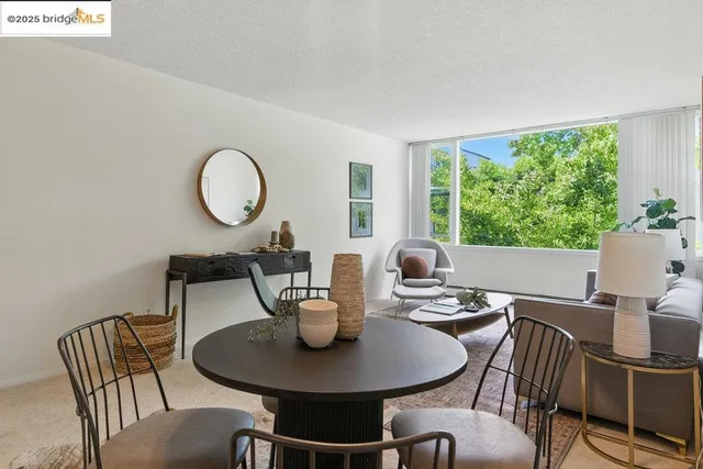 a view of a dining room with furniture window and outside view