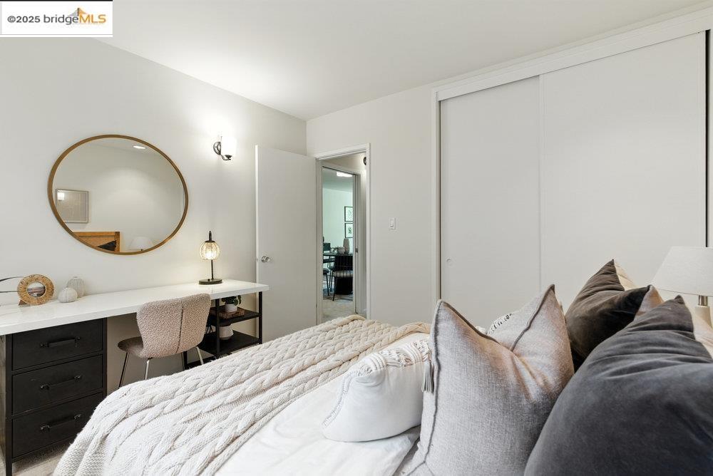 2601 College Avenue, Unit 203 Berkeley, CA 94704 - Photo 18 of 38 Bedroom featuring a closet and an office area