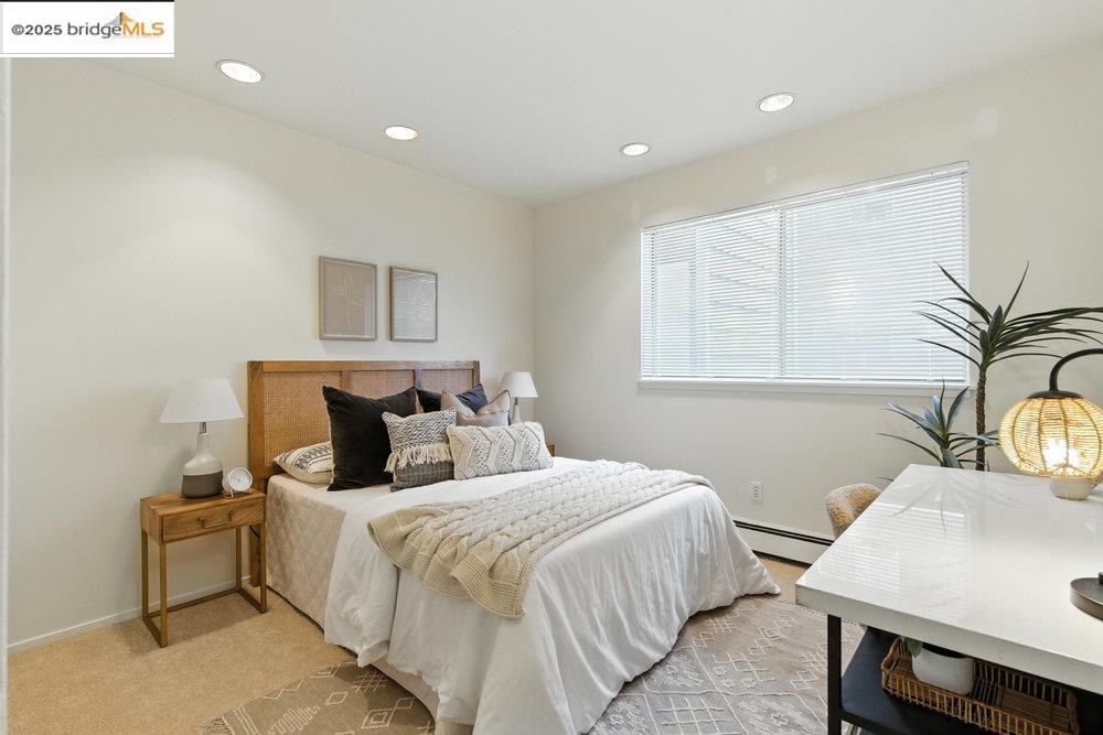 2601 College Avenue, Unit 203 Berkeley, CA 94704 - Photo 9 of 38 Bedroom with recessed lighting, a baseboard radiator, and light colored carpet