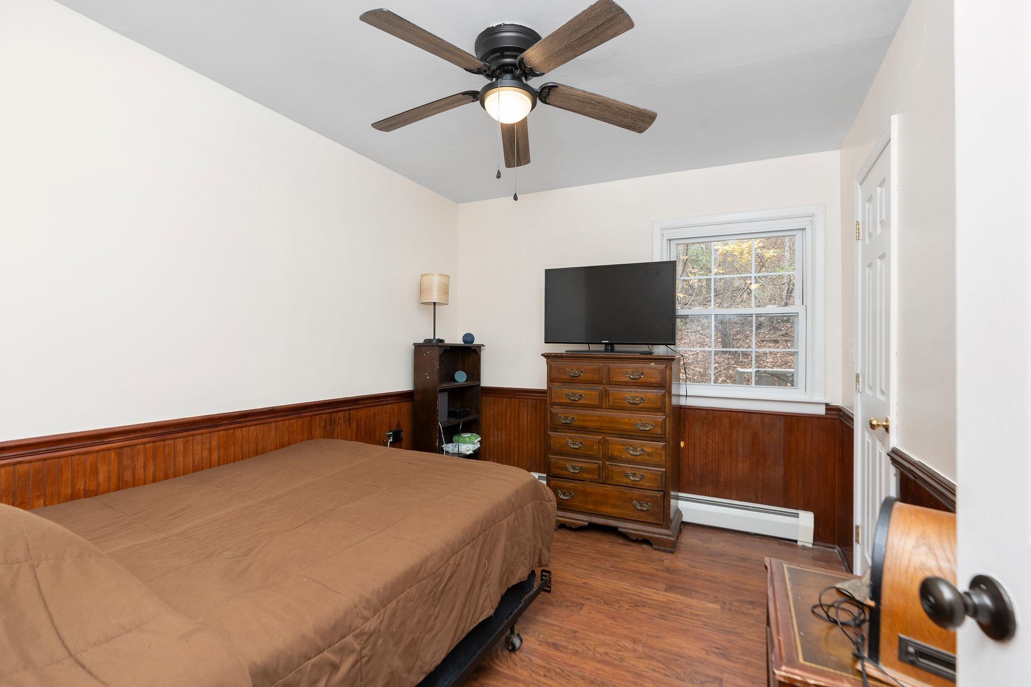 887 Bright Hollow Road Deerfield, VA 24432 - Photo 17 of 73 a bedroom with a bed and a flat screen tv