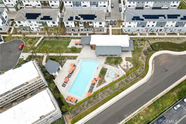 a view of a swimming pool with outdoor seating