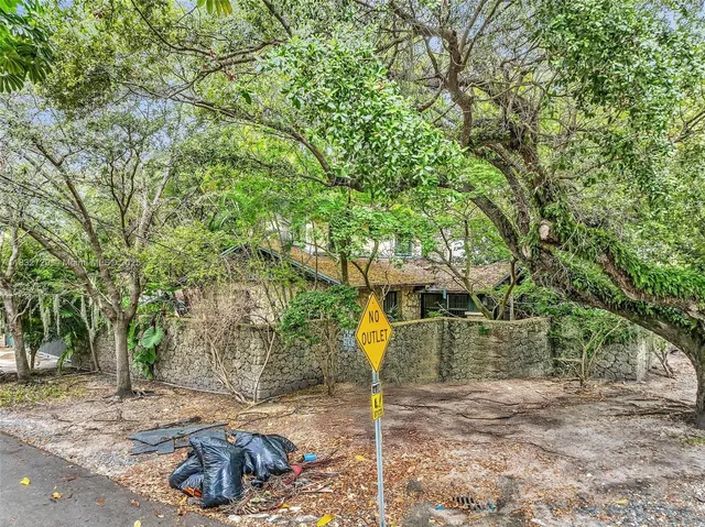 a backyard of a house with lots of green space