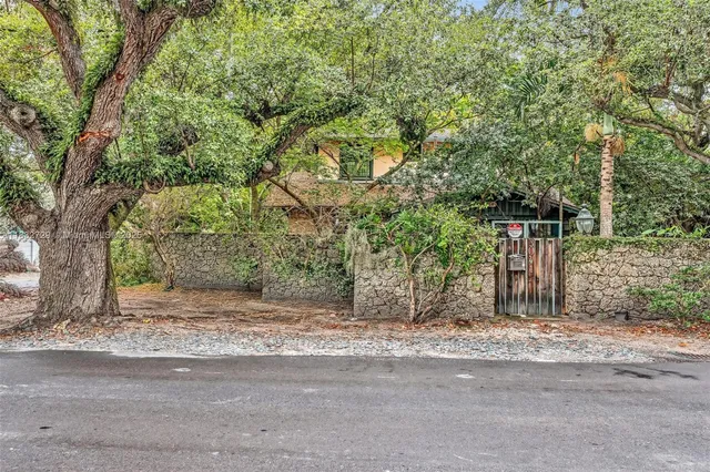 a house with trees in front of it