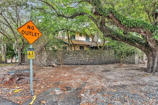 a view of a house with a street