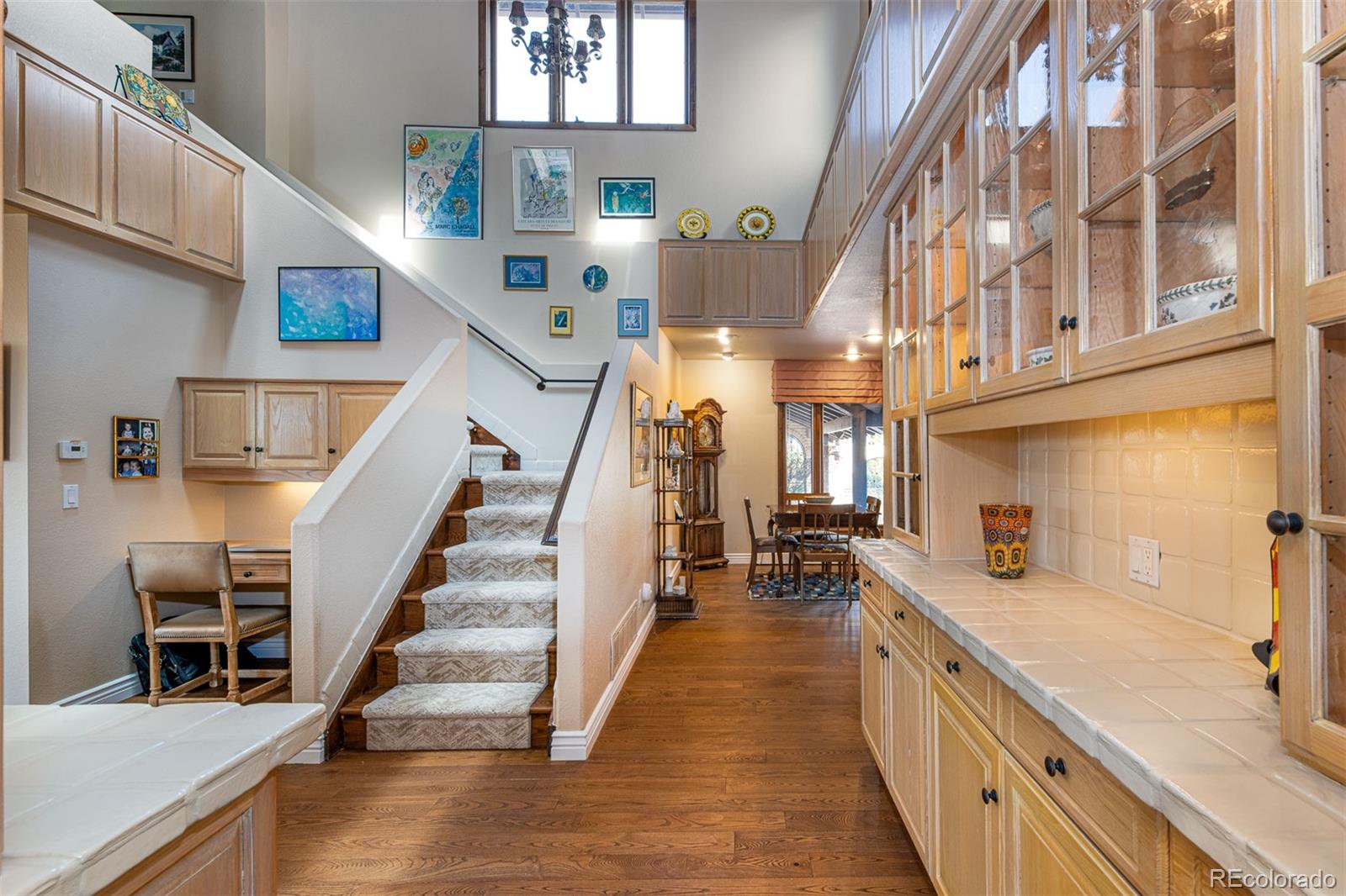 3942 South Pinehurst Circle Denver, CO 80235 - Photo 11 of 25 a view of entryway and hall with wooden floor