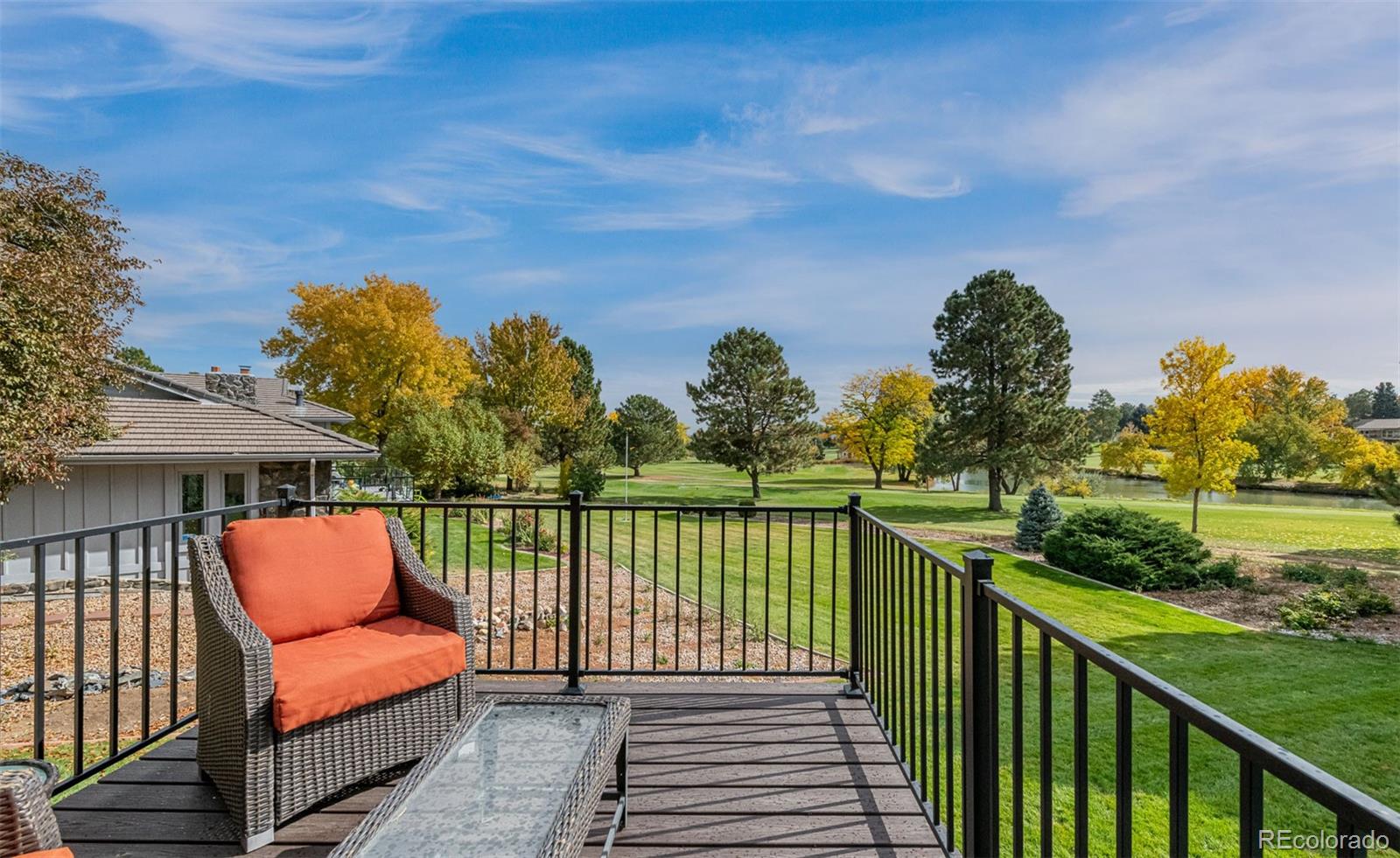 3942 South Pinehurst Circle Denver, CO 80235 - Photo 14 of 25 a balcony with wooden floor and outdoor space