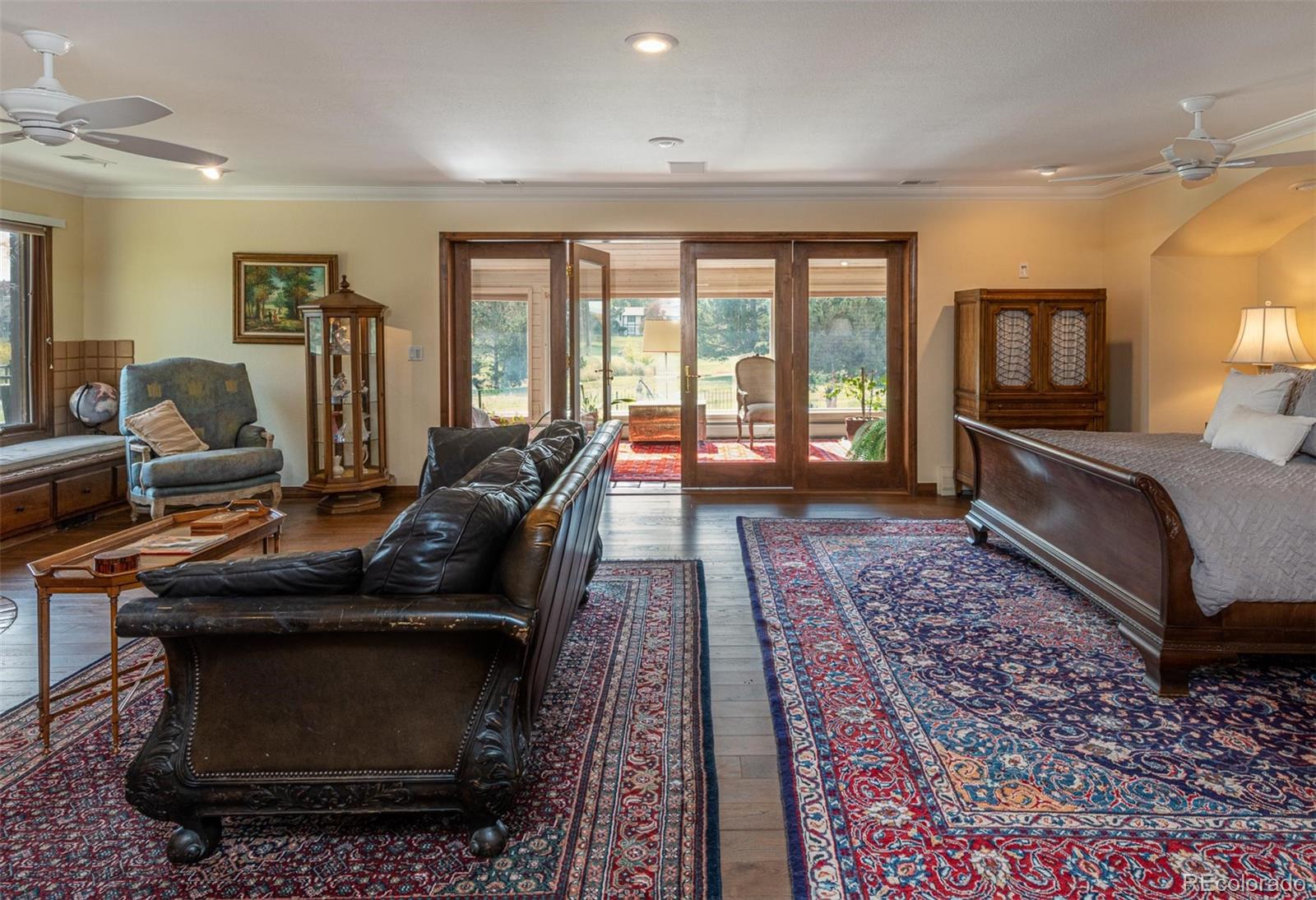 3942 South Pinehurst Circle Denver, CO 80235 - Photo 15 of 25 a living room with furniture and a fireplace