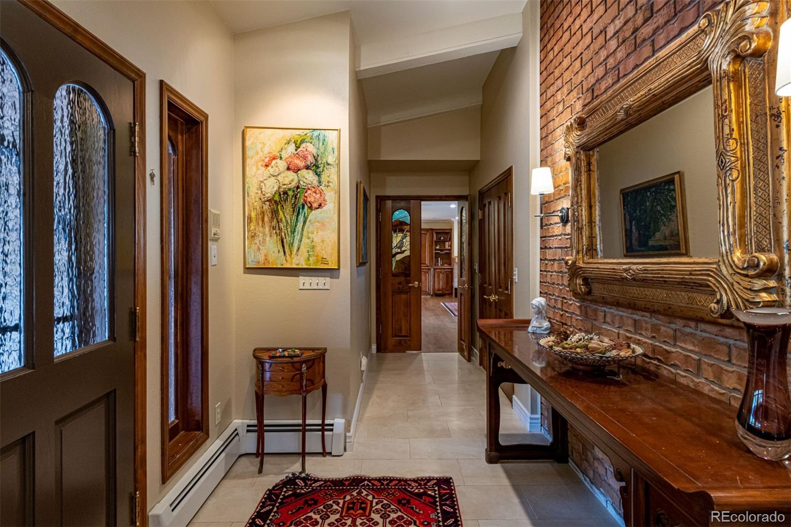 3942 South Pinehurst Circle Denver, CO 80235 - Photo 3 of 25 a living room with furniture and a window