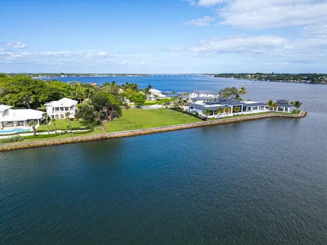 an aerial view of a residential houses with swimming pool