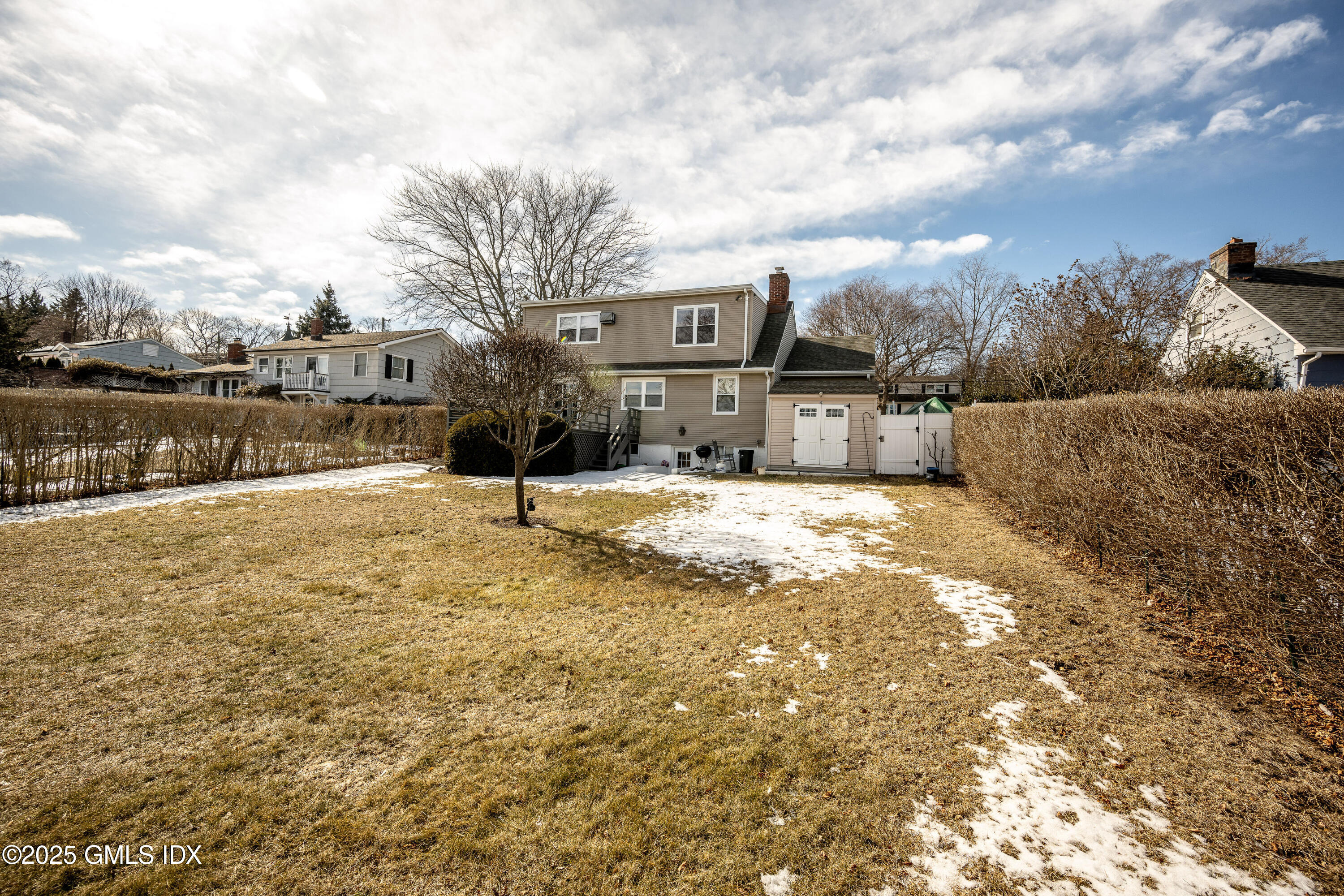 46 Cambridge Road Stamford, CT 06902 - Photo 5 of 29 a view of a lake with houses