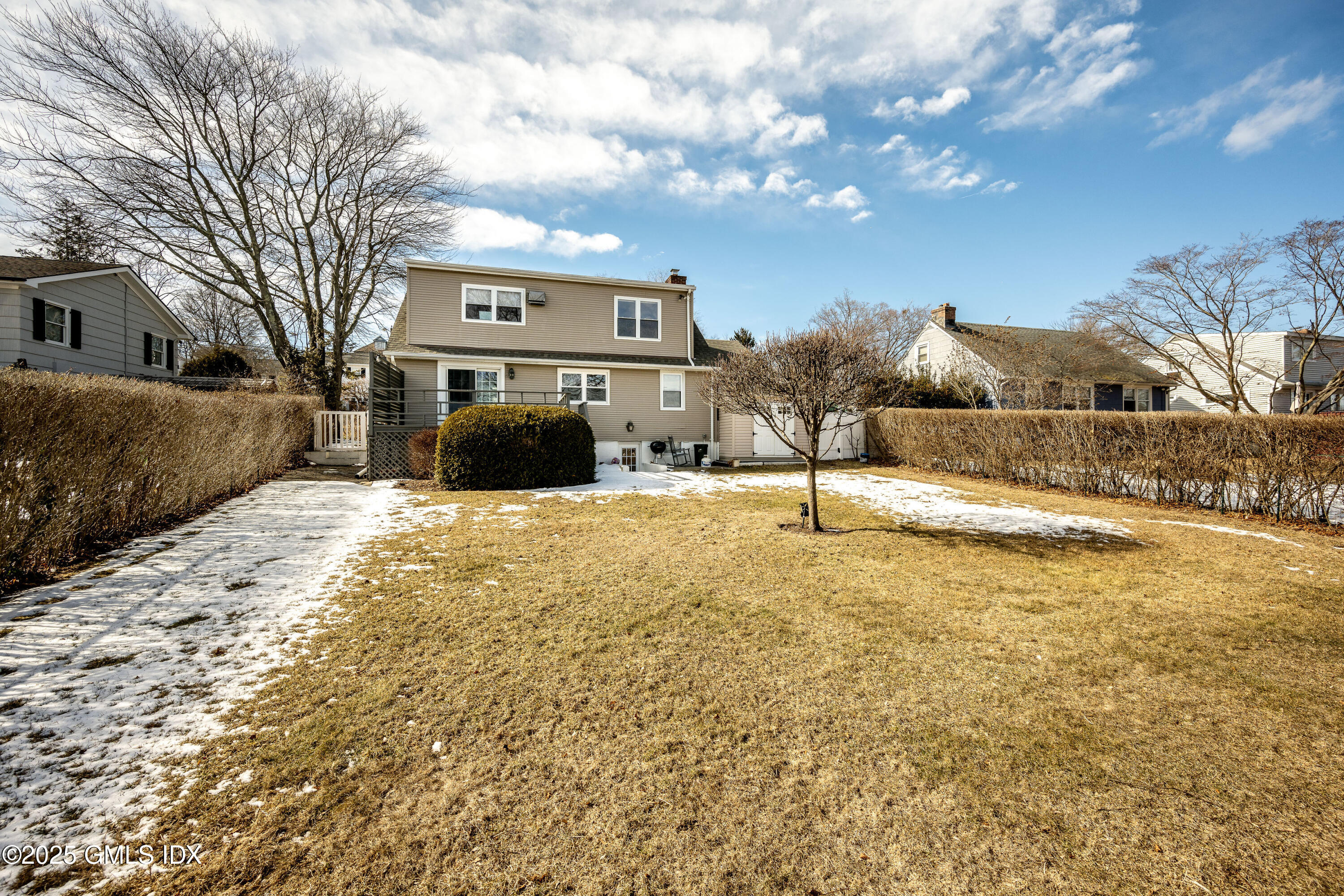 46 Cambridge Road Stamford, CT 06902 - Photo 6 of 29 a view of a yard with a house