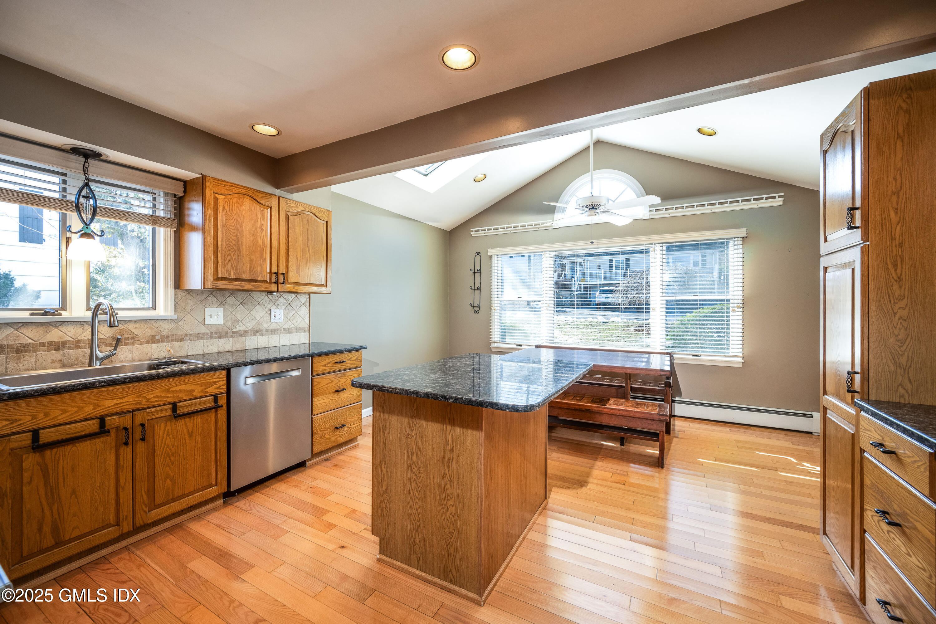 46 Cambridge Road Stamford, CT 06902 - Photo 10 of 29 a kitchen with granite countertop a stove and a sink