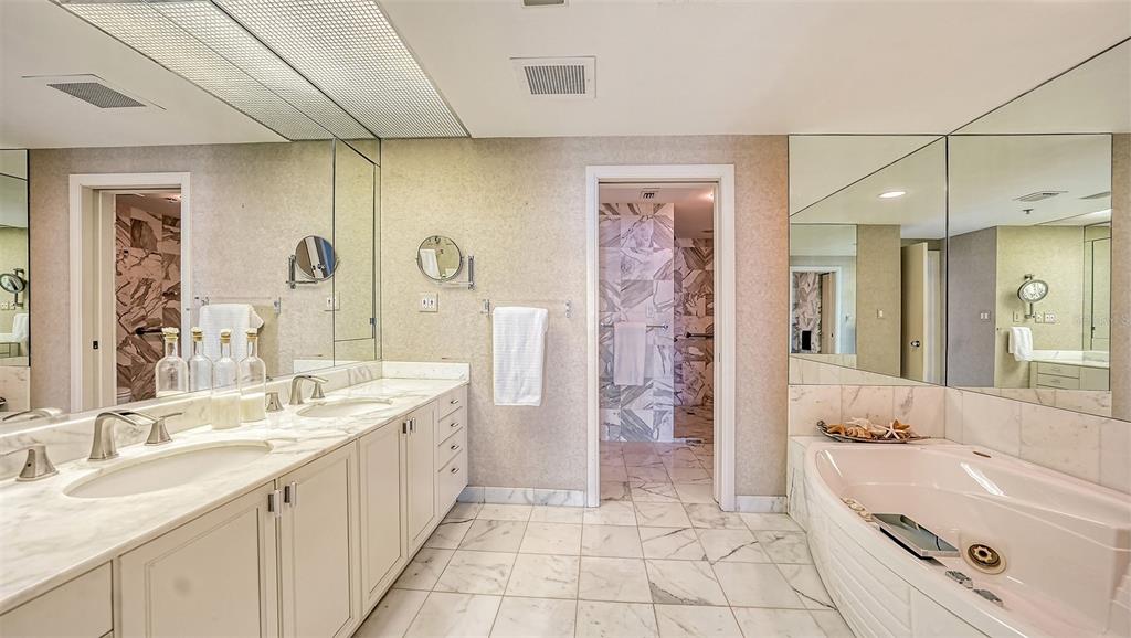 455 Longboat Club Road, Unit 608 Longboat Key, FL 34228 - Photo 18 of 57 Master bathroom with dual sinks, oversized jacuzzi tub.