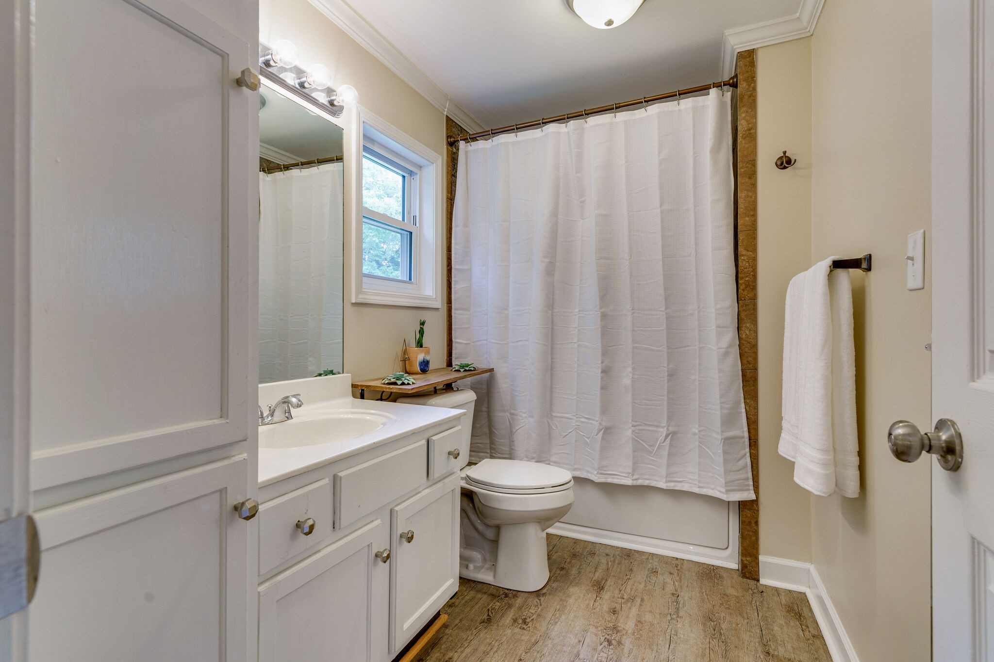 1521 Hogan Road Burns, TN 37029 - Photo 18 of 33 a bathroom with a sink a toilet and shower