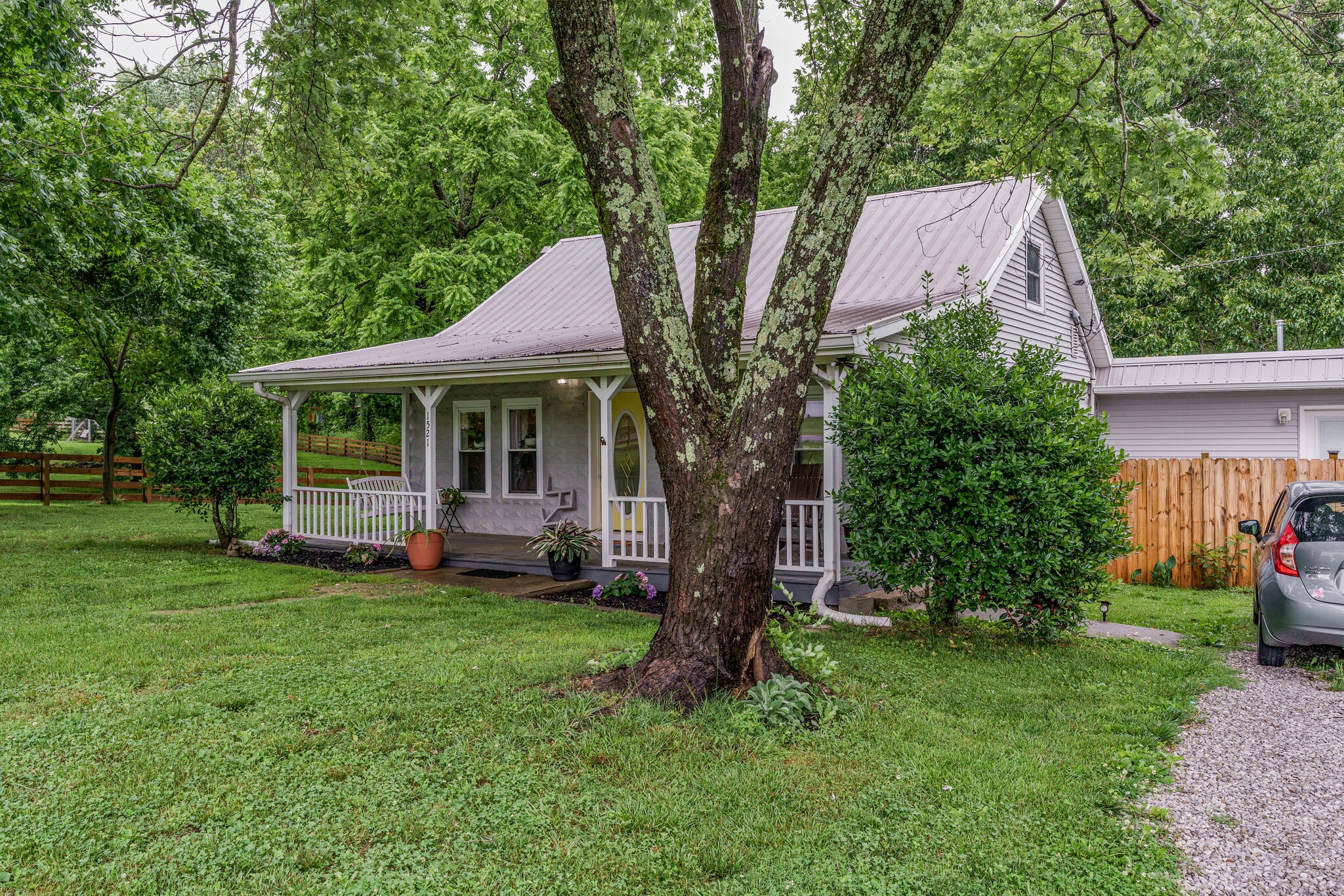 1521 Hogan Road Burns, TN 37029 - Photo 3 of 33 a view of a house with a yard and sitting area