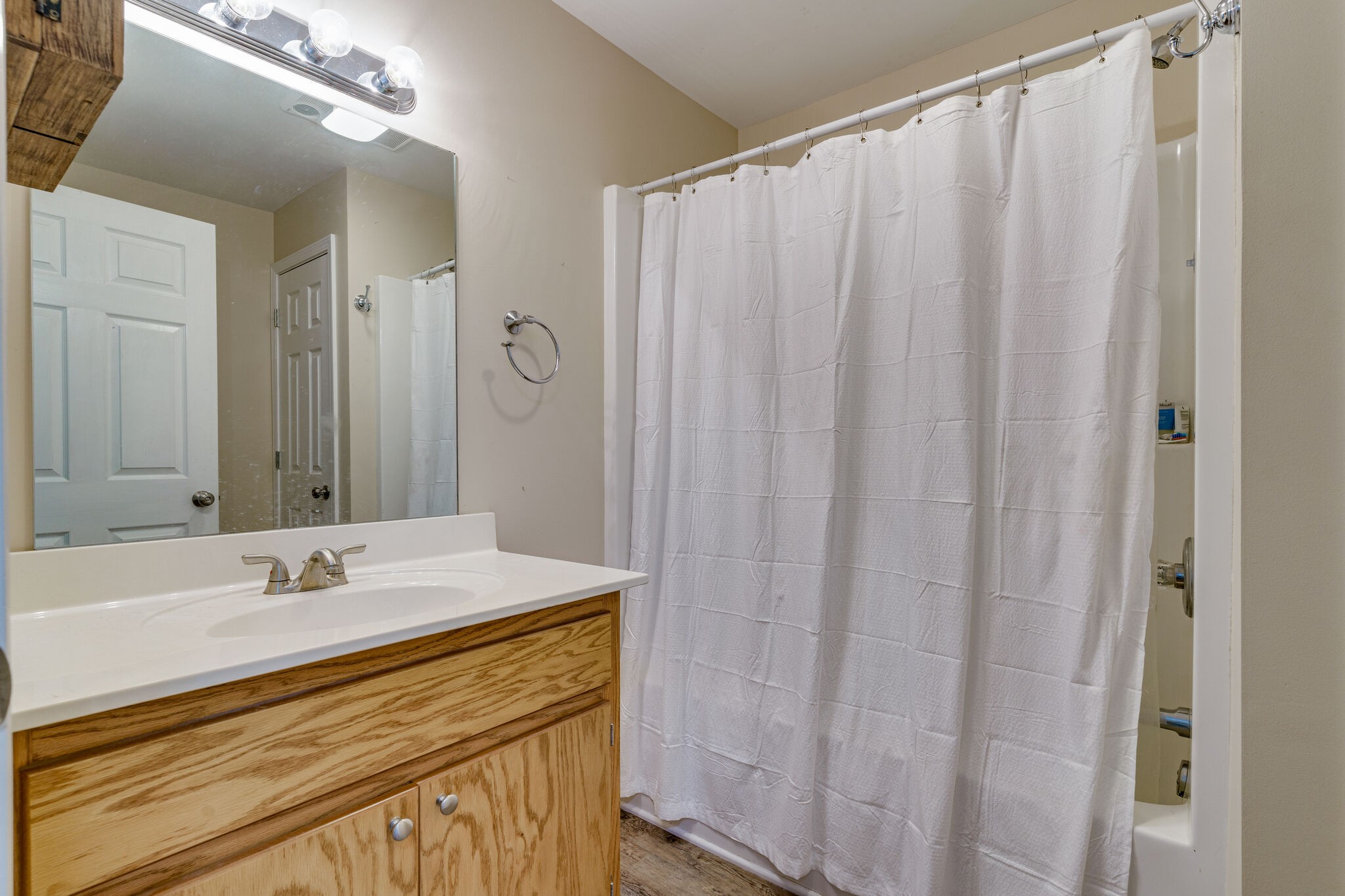 1521 Hogan Road Burns, TN 37029 - Photo 23 of 33 a bathroom with a sink and a mirror