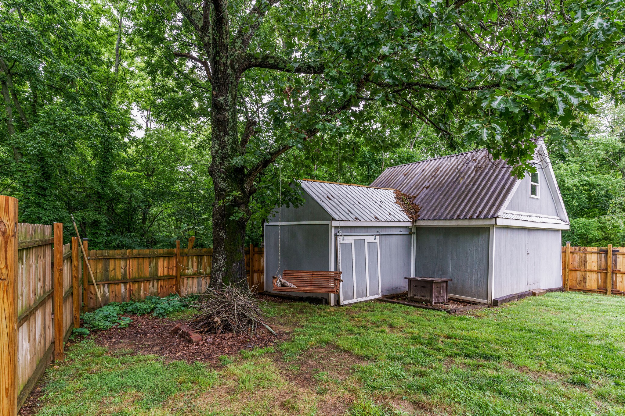 1521 Hogan Road Burns, TN 37029 - Photo 29 of 33 a view of a house with a backyard and wooden fence