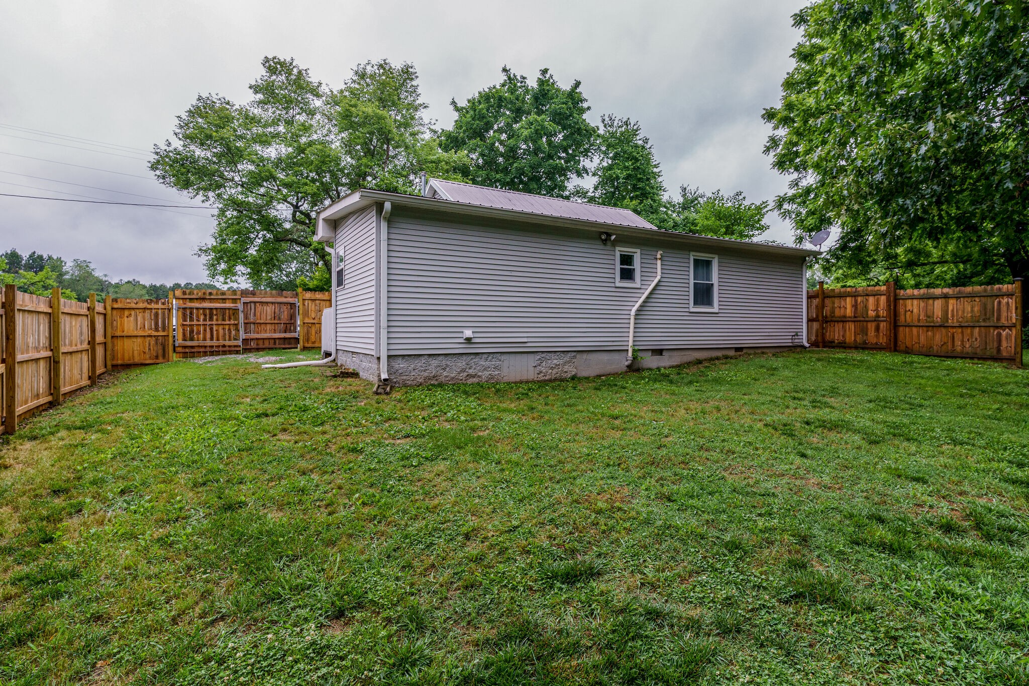 1521 Hogan Road Burns, TN 37029 - Photo 31 of 33 a backyard of a house with lots of green space