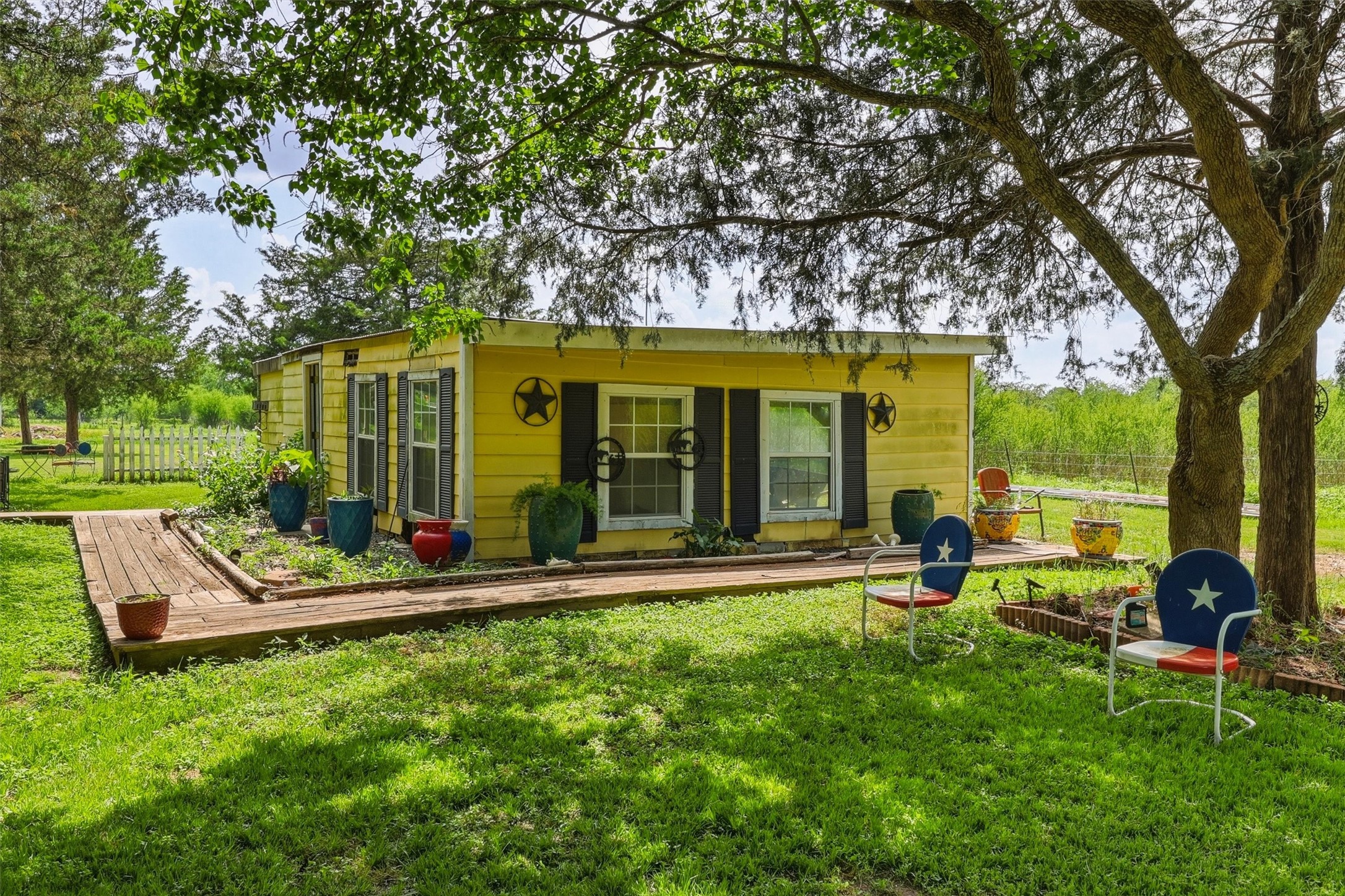 2325 Skrivanek Road Sealy, TX 77474 - Photo 35 of 36 a view of a house with backyard porch and sitting area