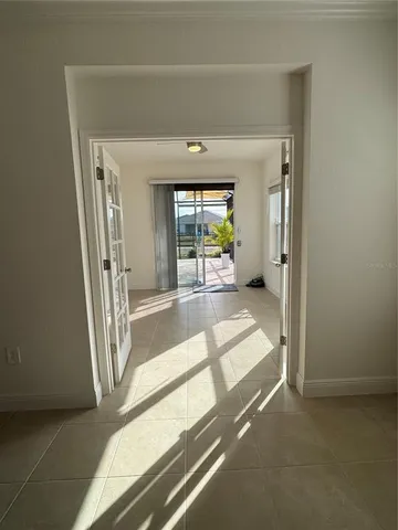 a view of a hallway with a living room