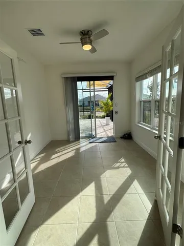 a view of an empty room with a window