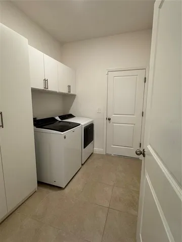 a utility room with washer and dryer