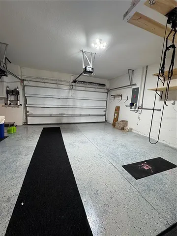 a kitchen with a sink a stove and cabinets