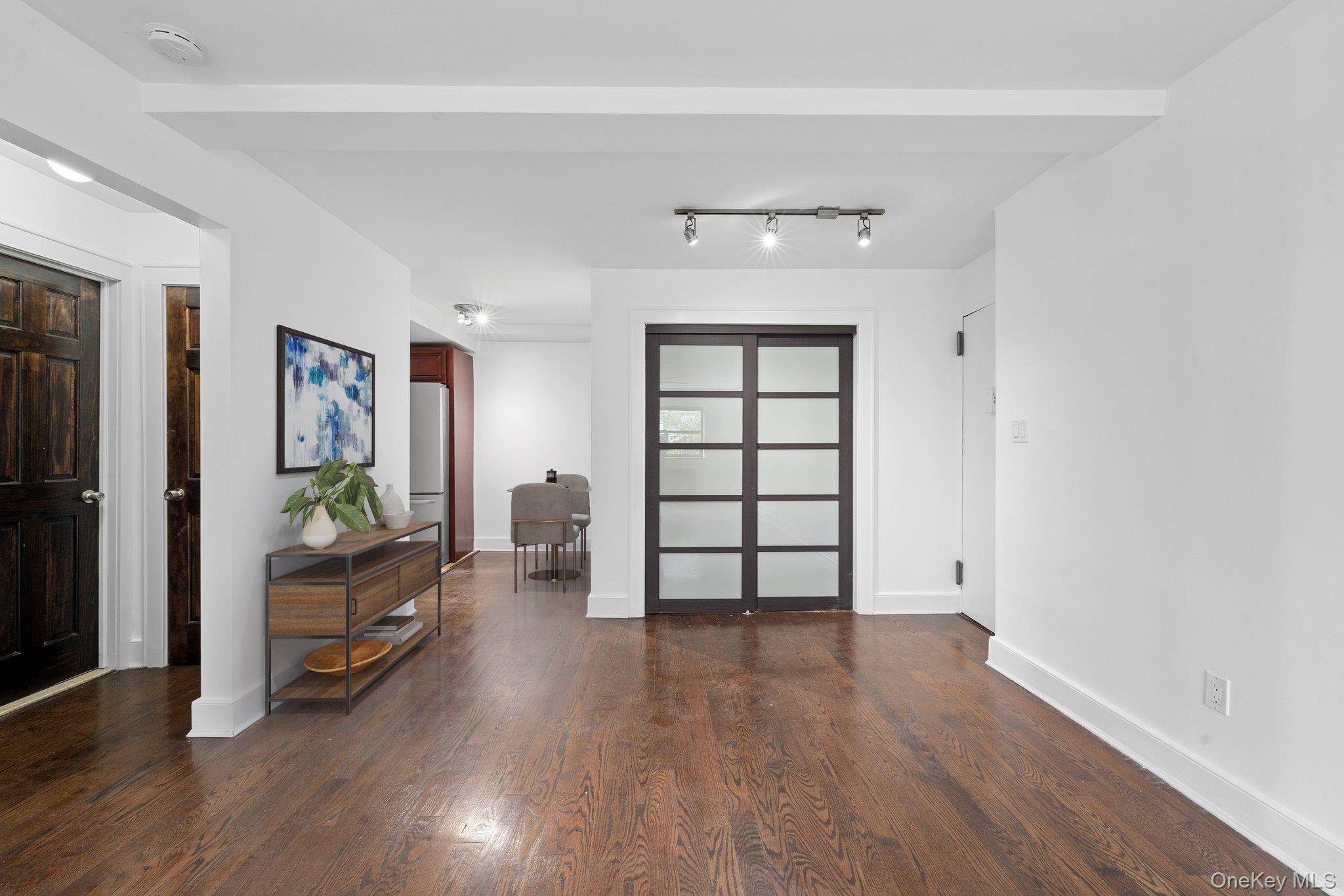 2545 Sedgwick Avenue, Unit 4H Bronx, NY 10468 - Photo 4 of 10 wooden floor in an empty room with a window