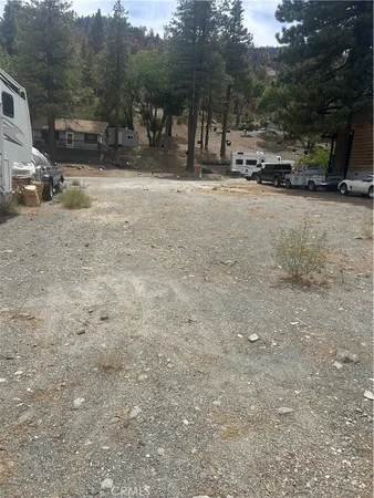 a view of street with parked cars