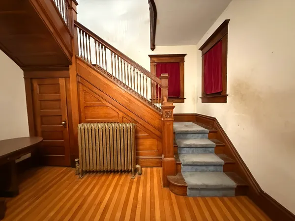 a view of entryway with wooden floor