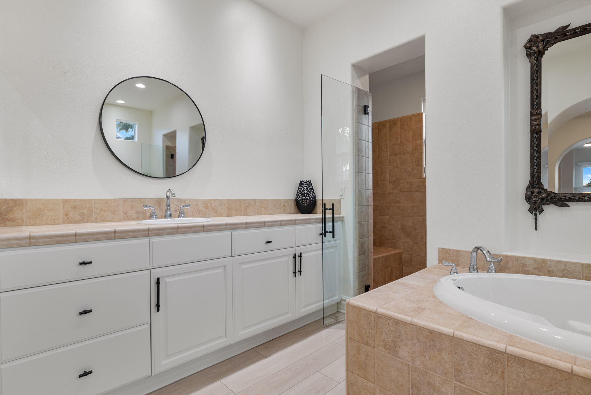 6 Via Santa Ramona Rancho Mirage, CA 92270 - Photo 16 of 60 a spacious bathroom with double sink a mirror and a