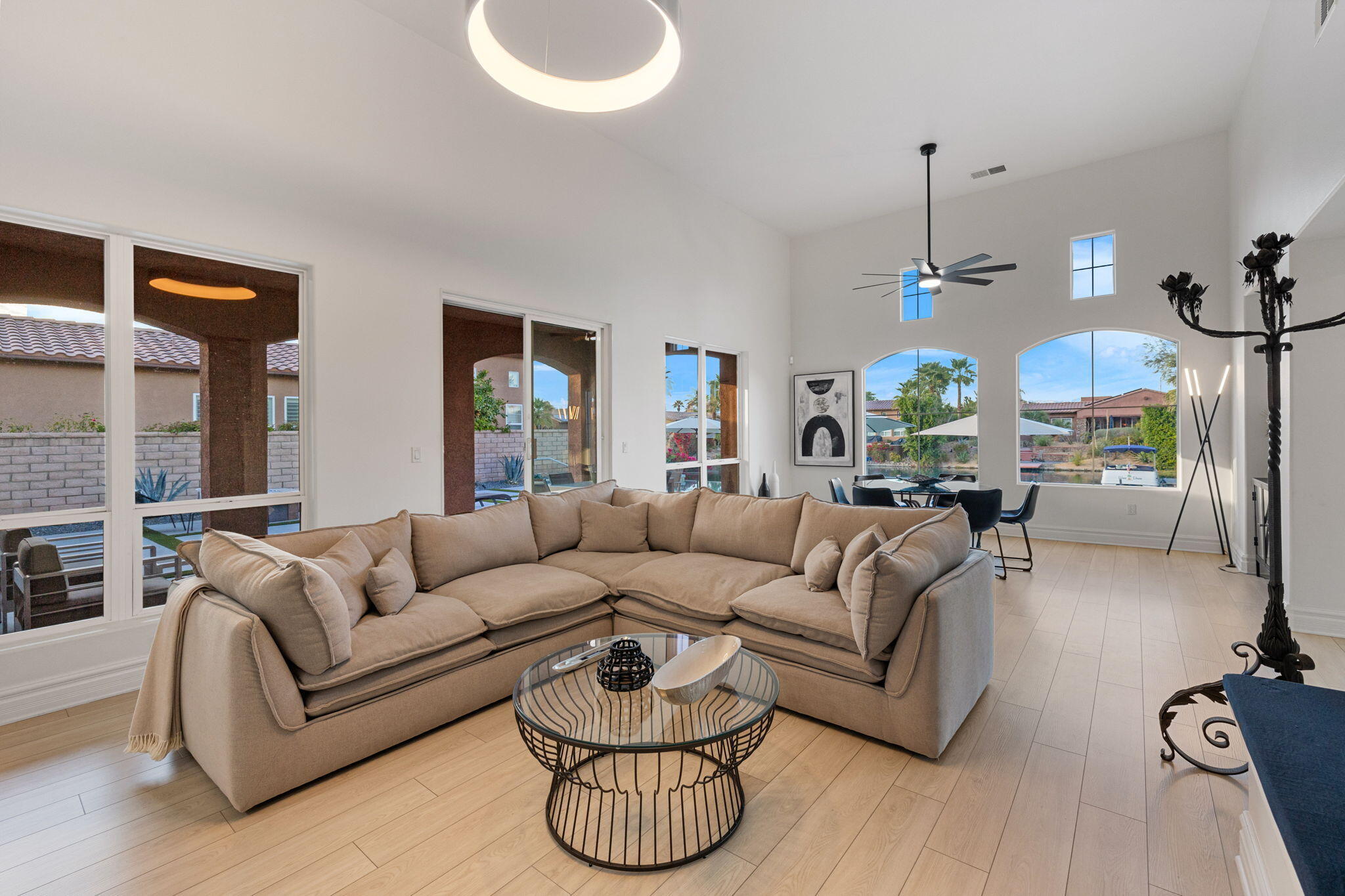 6 Via Santa Ramona Rancho Mirage, CA 92270 - Photo 20 of 60 a living room with furniture a dining table and a chandelier