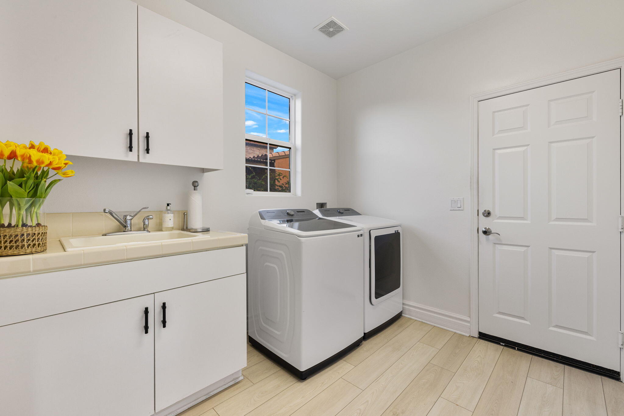 6 Via Santa Ramona Rancho Mirage, CA 92270 - Photo 31 of 60 a utility room with cabinets washer and dryer