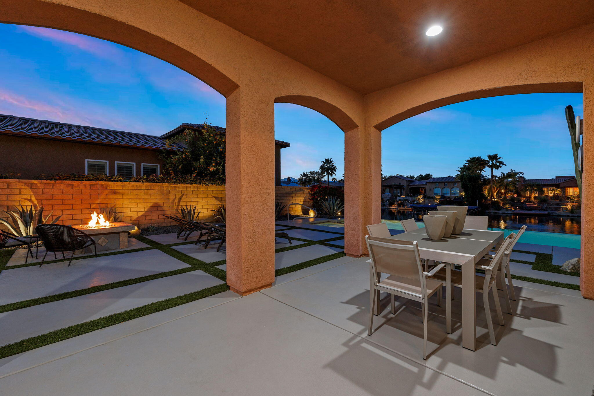 6 Via Santa Ramona Rancho Mirage, CA 92270 - Photo 40 of 60 a view of a dining room with chairs and table in the patio