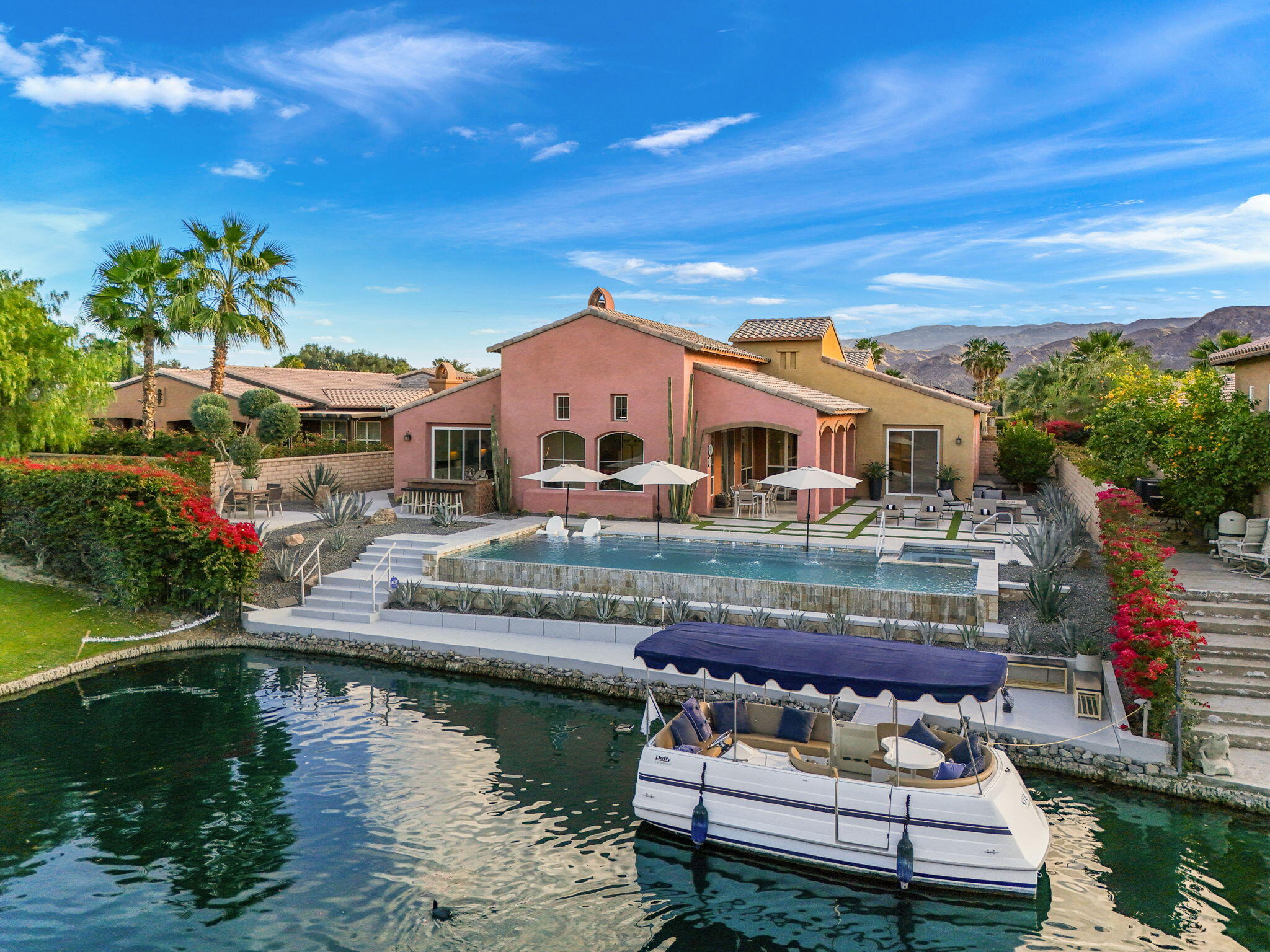 6 Via Santa Ramona Rancho Mirage, CA 92270 - Photo 41 of 60 a balcony with furniture and a lake view